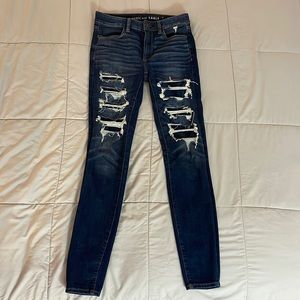 Like new, American Eagle Hi-rise Jegging.  Dark wash.  Distressed.